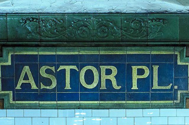 A photo of a sign at the Astor Place station that reads "Astor Pl."